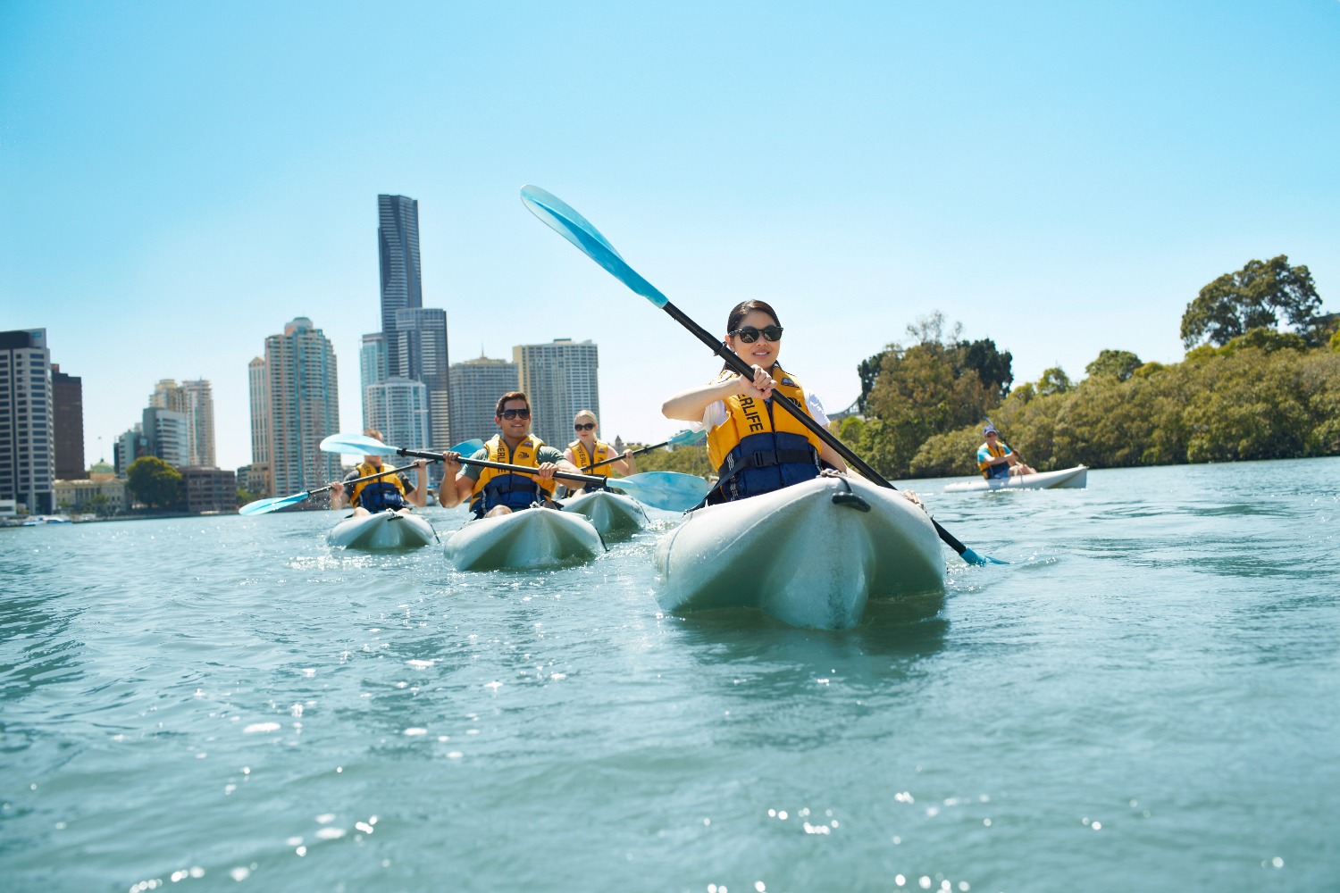 Group kayaking on the Brisbane River. 