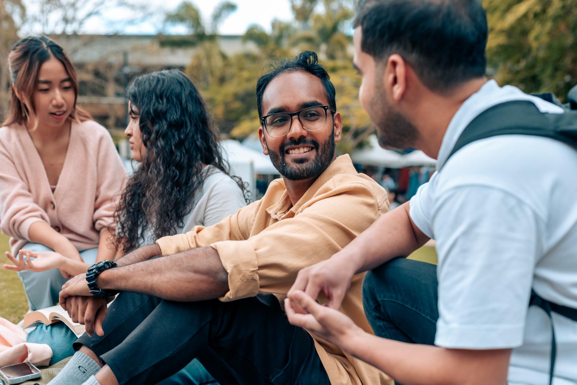 A group of students having a picnic. 